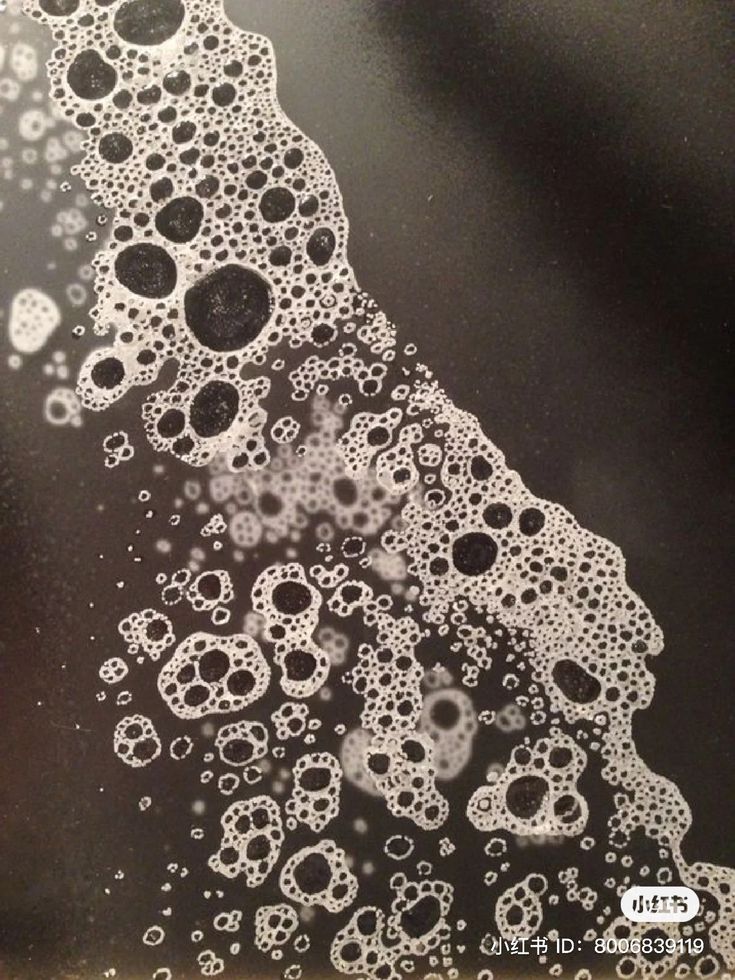 a black and white photo with bubbles on it