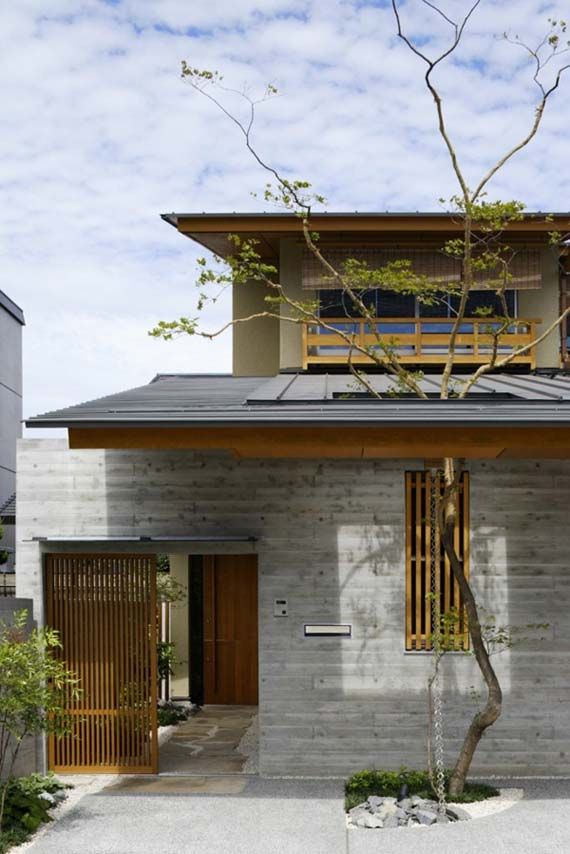 the house is made out of concrete and has two stories on each level that are connected to one another