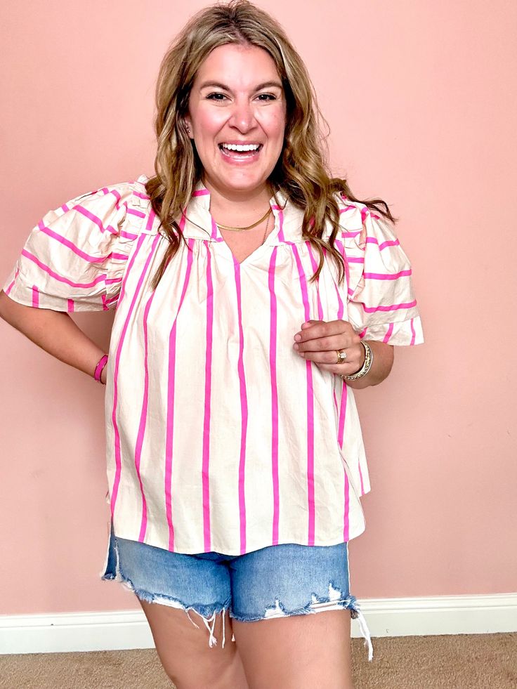 Get ready for some fun in the sun with our Papaya Punch Top! Featuring a playful stripe pattern and a flattering v neck, this short sleeve top is perfect for any summertime adventure. Stay stylish and comfortable all day long with this must-have addition to your wardrobe. Details: 100% Cotton Runs: OversizedKrista is wearing a Small Beach Tops With Striped Collar And Short Sleeves, Summer Striped Short Sleeve Tops, Summer Vacation Tops With Striped Collar, Striped Short Sleeve Summer Top, Casual Vacation Top With Striped Collar, Casual Top With Striped Collar For Vacation, Casual Tops With Striped Collar For Vacation, White Top With Striped Collar For Beach, White Summer Tops With Vertical Stripes