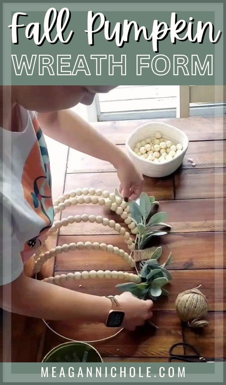 a woman is making a wreath out of beads and other items on a table with text overlay that reads, fall pumpkin wreath form