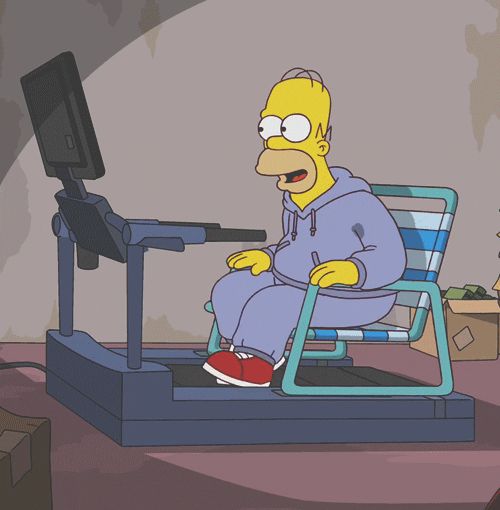 the simpsons sitting on a treadmill in front of a tv screen with his mouth open