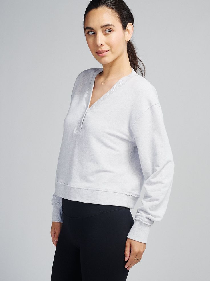 Your everyday casual-meets-loungewear just got an new staple added to the mix - meet the Varsity Henley Sweatshirt. Made from our signature lightweight, breathable, extra-soft french terry, this Varsity Henley may sport a classic athletic-inspired vibe, but it performs like a champion. Featuring a slight crop with raglan shoulder, oversized sleeves, and raw edges, it's a must-have for everyday wear. Style #TW912 Varsity Cotton Sweatshirt In Athletic Heather, Varsity Athletic Heather Sports Top, Athletic Heather Moisture-wicking Casual Sweatshirt, Athletic Heather Crew Neck T-shirt, Soft-washed French Terry Long Sleeve Sweatshirt, Oversize Sleeves, Bra Dress, Quarter Zip Sweatshirt, Mens Sweatpants