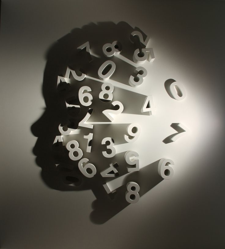 the shadow of a person's head with numbers on it