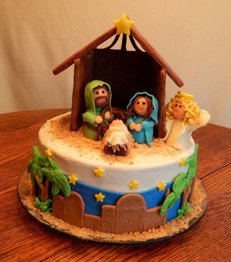 there is a cake decorated to look like a nativity scene on top of a table