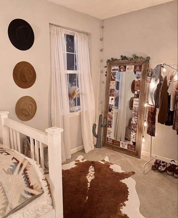 a bedroom with a cow hide rug and several hats hanging on the wall