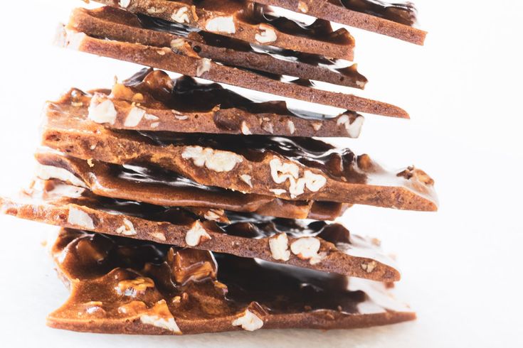 a stack of chocolate and marshmallows on top of each other in the shape of a christmas tree