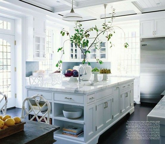 an instagram photo of a kitchen with white cabinets and wood floors, along with the caption that reads'i hour ago lavender hill interiors '