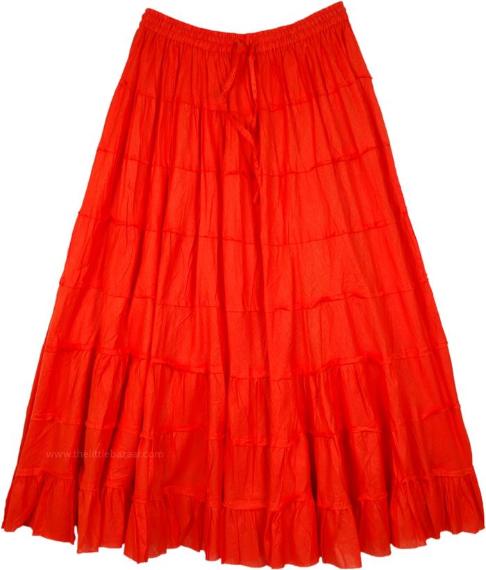 An airy, everyday wear, cotton full skirt in red divided into eight tiers with slight gathers on them.  The tiered layers have an unfinished hem and the skirt is fully lined with cotton fabric as well. #tlb #XLPlus #Misses #TieredSkirt #Dance #Redtieredlongskirt #cottonredlongskirt Spring Red Cotton Maxi Skirt, Red Cotton Maxi Skirt For Spring, Orange Ruffled Tiered Skirt Bottoms, Orange Ruffled Tiered Skirt, Red Tiered Gathered Maxi Skirt, Red Gathered Tiered Maxi Skirt, Red Cotton Ruffled Skirt, Red Cotton Ruffle Skirt, Red Ruffled Cotton Skirt