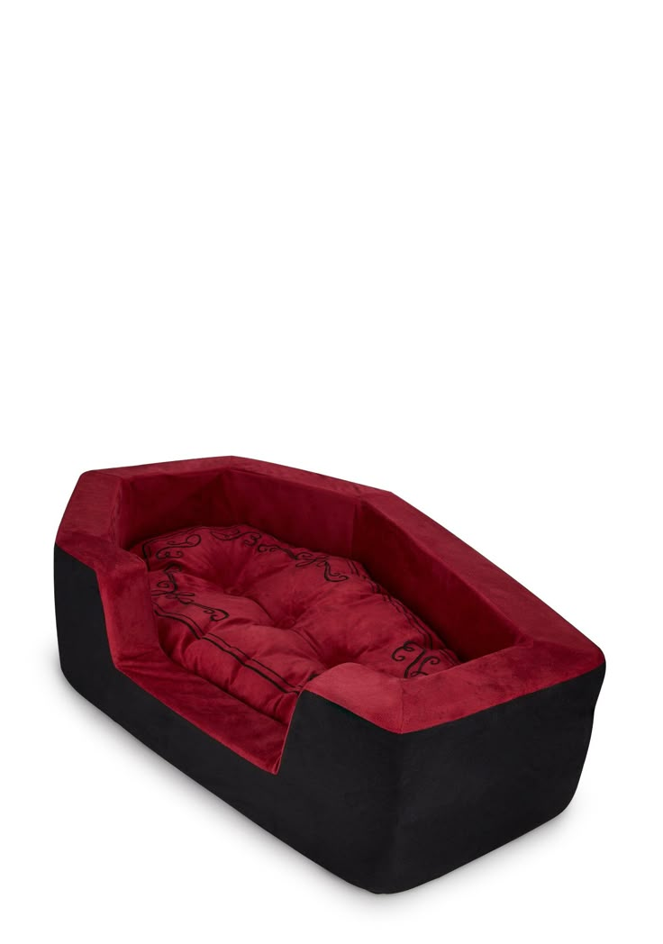 a red and black dog bed on a white background