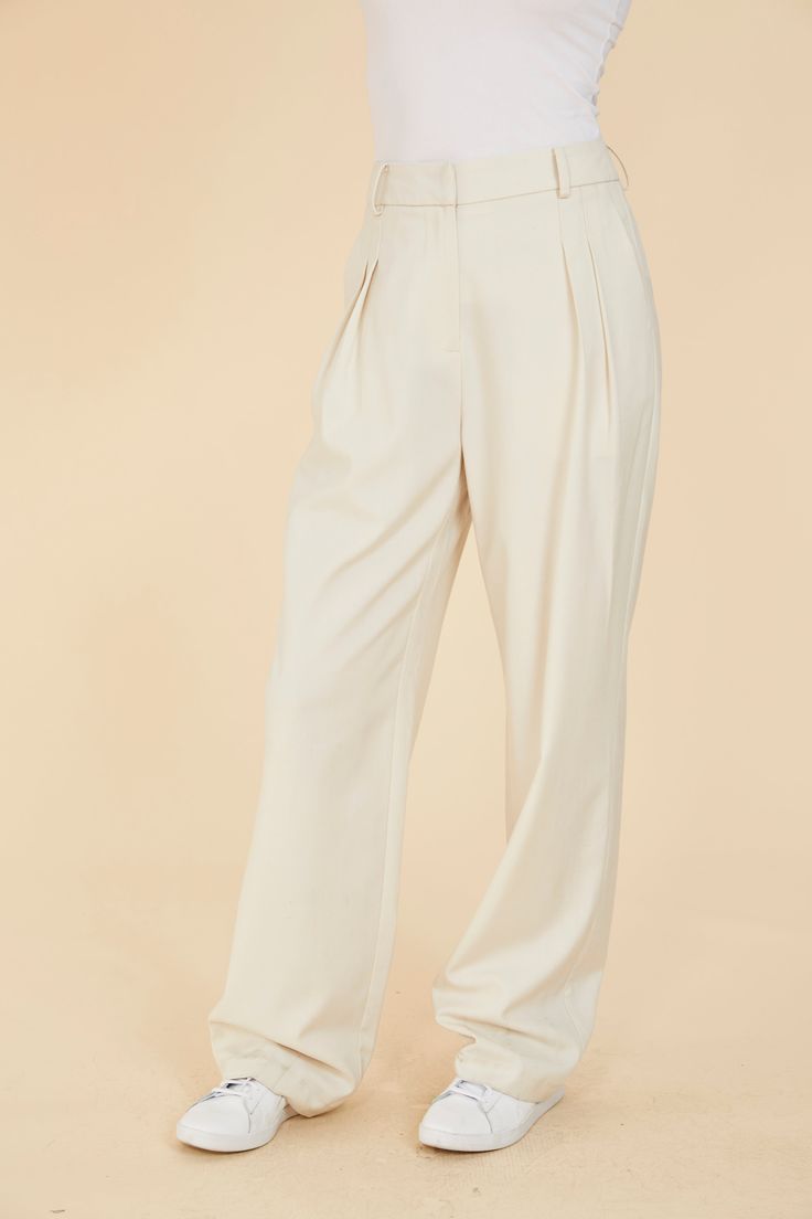 Straddle the line between polished and relaxed with our Pleated Wide Leg Pants. The front pleats lend a formal touch, while the wide leg and loose fit allow for a more relaxed, comfortable style. Available in an elegant cream color, these women’s pleated pants seamlessly transition from refined to casual, offering versatility for various occasions. Elevate your wardrobe with this sophisticated yet laid-back staple. Pleated Wide leg Loose fit Match with Double Pocket Crop Jacket style 75405 Dry c Cream Pant, Pleated Wide Leg Pants, Pleated Pant, Cream Pants, Sweater Blazer, Comfortable Style, Pleated Pants, Romper Dress, Crop Jacket