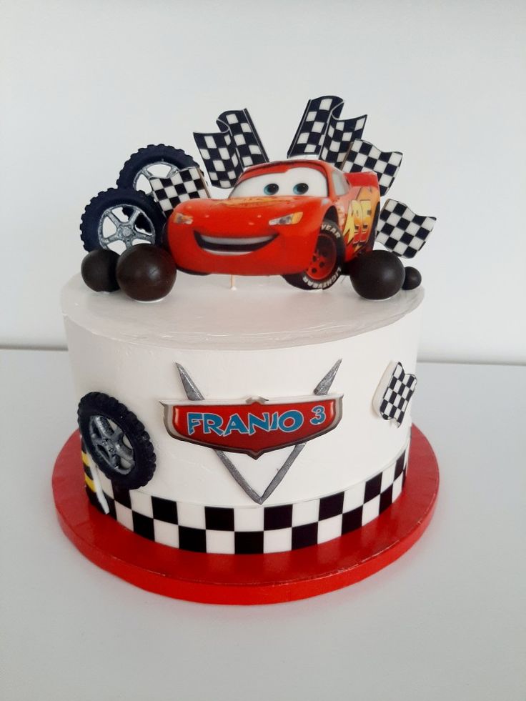 a birthday cake with cars on top