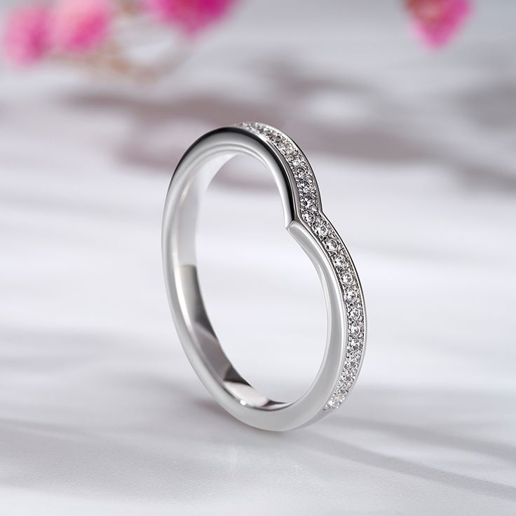 Simple and elegant, this unique ring features sparkling round stones on a plain band. It's beautiful, elegant, and truly statement-making. Smooth finish provides a comfortable fit for everyday wear. Never miss it.Carat Weight: 0.25 ctStone Size: 1 mmStone Type: Jeulia® StoneNumber of Stones: 25 Weight: 2.1 gWidth: 2.2 mmHeight: 2 mmThickness: 1.4 mmMaterial: 925 SilverPlating Color: Silver Elegant Adjustable Crystal Ring In Diamond White, Elegant Adjustable Diamond White Crystal Ring, Formal Heart Ring With Diamond Accents And Cubic Zirconia, Anniversary Crystal Ring With Diamond Halo, Elegant Silver Open Crystal Ring, Elegant Halo Diamond Ring Gift, Elegant Halo Ring With Round Stone For Formal Occasions, Elegant Crystal Ring Gift, Elegant Adjustable Diamond Ring With Cubic Zirconia