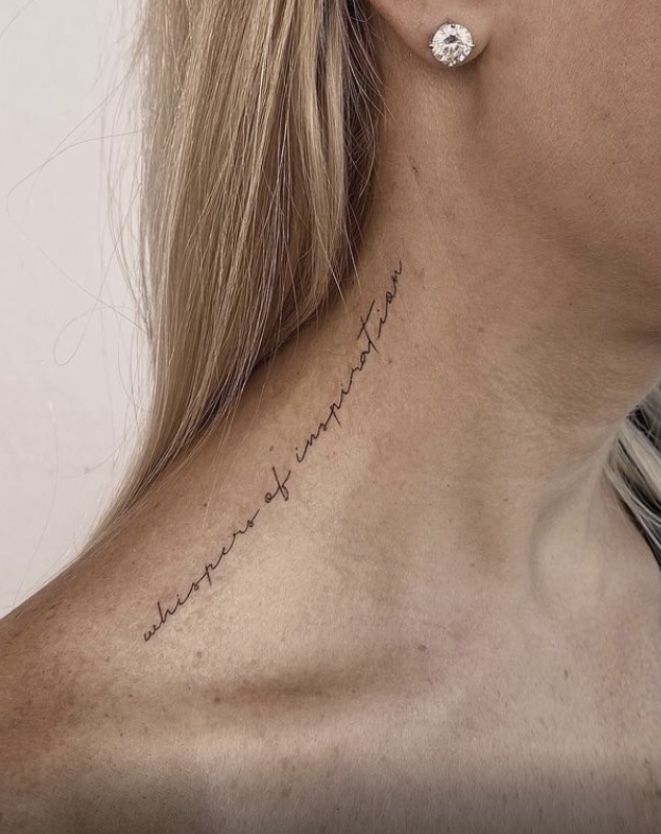 a woman with a tattoo on her neck