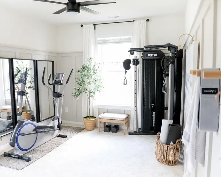 a home gym with mirrors and exercise equipment