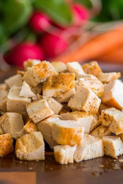 chopped up food sitting on top of a wooden cutting board