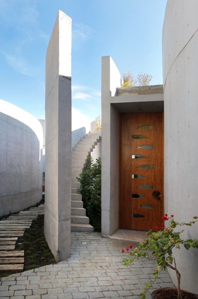 a wooden door sitting next to a set of stairs