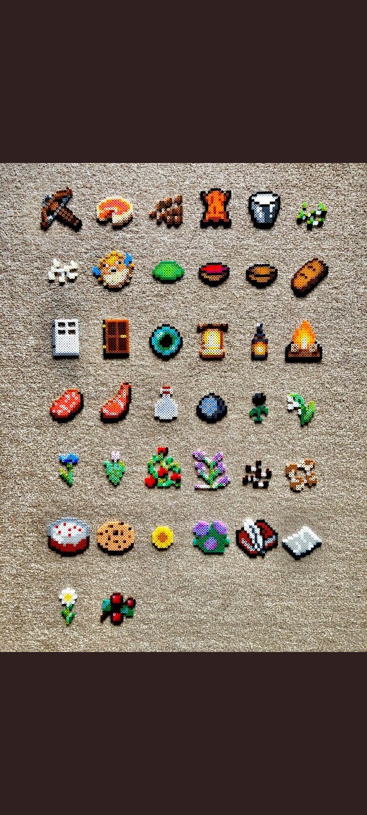 an array of pins and magnets laid out on the floor