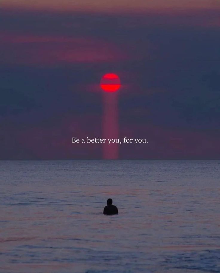 a person swimming in the ocean with an orange sun behind them and a quote on it