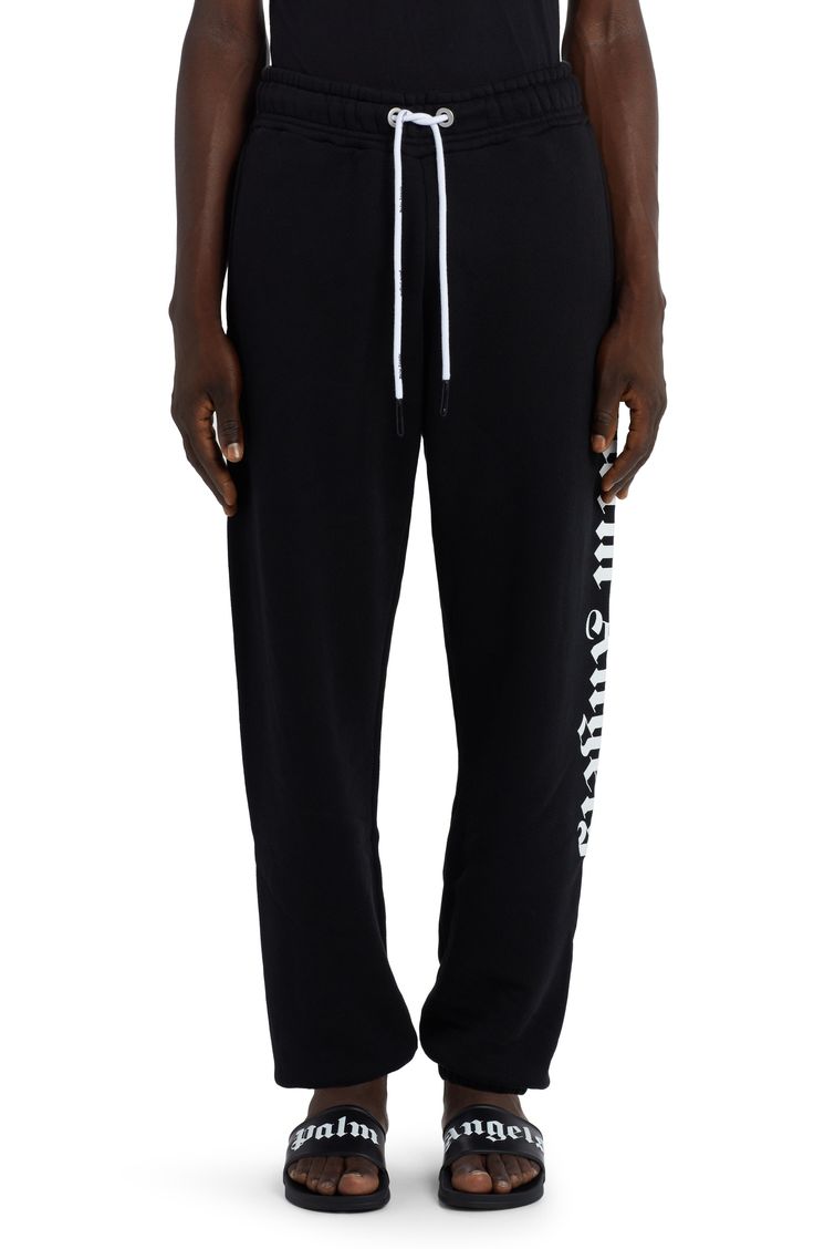 The Milanese label’s Gothic logo boldly brands one side of cotton French terry sweatpants that are equally comfy and street-savvy. 31" inseam; 11" leg opening; 14" front rise; 18" back rise (size Medium) Elastic/drawstring waist Side welt pockets; back welt pocket 100% cotton Hand wash, dry flat Made in Portugal New Concepts @Nordstrom Sporty Joggers With Logo Waistband For Streetwear, Black Sweatpants With Logo Print For Loungewear, Black Joggers With Logo Waistband For Streetwear, Black Cotton Joggers With Logo Print, Black Cotton Pants With Logo Print, Cotton Bottoms With Logo For Loungewear, Cotton Sweatpants With Logo Print In Athleisure Style, Logo Print Cotton Sweatpants In Athleisure Style, Cotton Athleisure Sweatpants With Logo Print