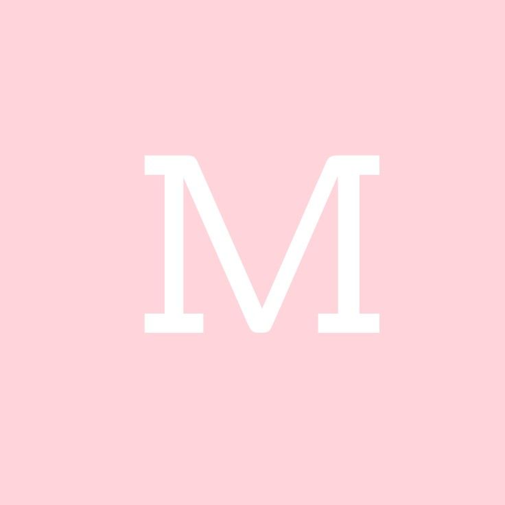 the letter m in white on a pink background