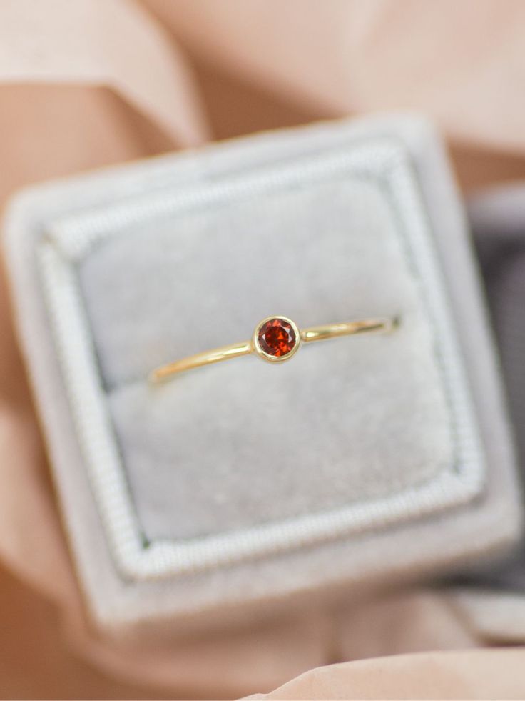 A romantic walk under falling leaves and shades of orange. The Autumn Lane Ring is an essential classic ring to wear on special occasions or as a part of your everyday accessory. It could be an alternative engagement ring or a push present. Elegant Orange Birthstone Ring For Anniversary, Garnet And Citrine Ring, Elegant Orange Birthstone Promise Ring, Orange Promise Ring Fine Jewelry, Elegant Orange Solitaire Jewelry, Orange 14k Gold Wedding Ring, Elegant Orange Sapphire Ring As Gift, Elegant Orange Solitaire Rings, Gold Garnet Birthstone Ring Gift