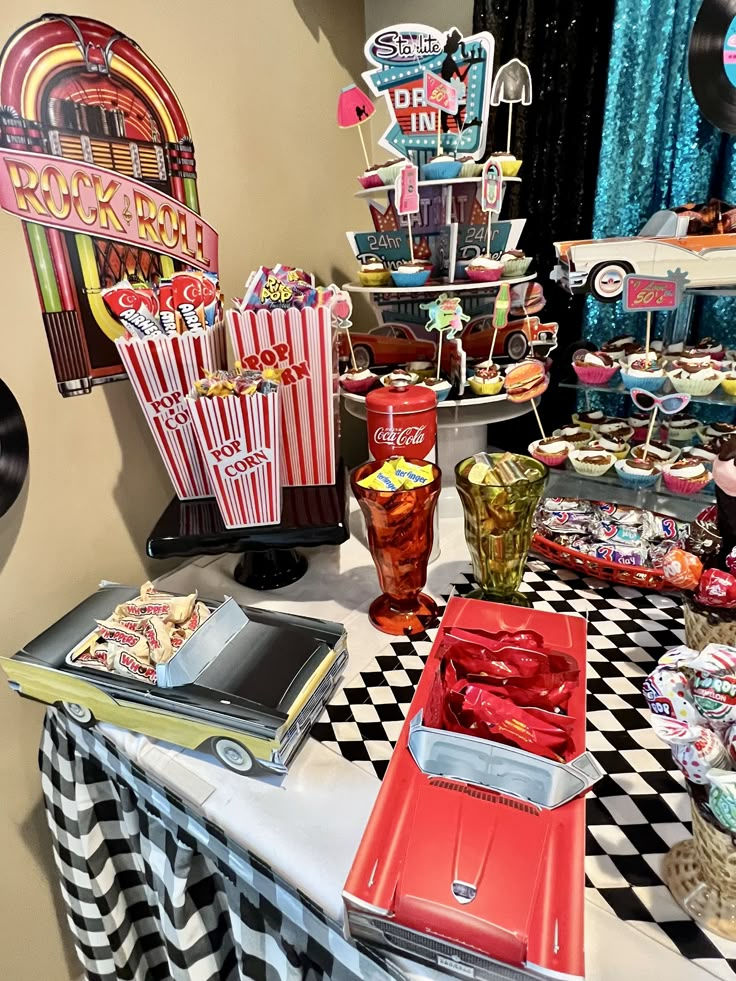 an assortment of food on a table at a movie themed birthday party or baby shower