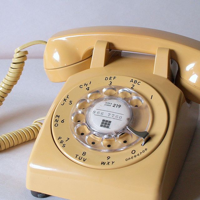 an old - fashioned rotary telephone is on display