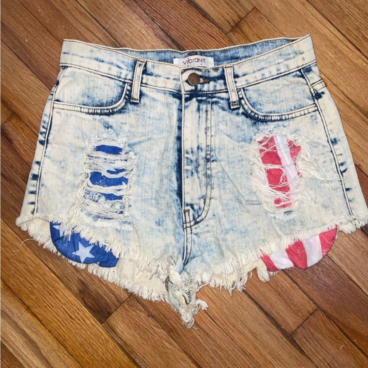 These Cheeky Shorts Are A Size Medium In Women’s Sizing And 98% Cotton With 2% Spandex. It Was Never Worn But Without Tags, With Two Pockets On The Front And Back. The Front Has A Ripped Style Which Shows The Inside Pockets Of The American Flag. One Side Is Red And White Pocket Stripes And Other Is A Blue And White Star Pocket. It Is A Washed Denim Style. It Was Purchased From A Boutique In Brooklyn. 4th Of July Jean Shorts, Casual High Waist Bottoms With American Flag Print, Casual High-waist Bottoms With American Flag Print, Trendy Cutoff Shorts For 4th Of July, Trendy Spring Bottoms With Flag Print, Trendy High Rise Multicolor Bottoms, Trendy Multicolor High Rise Bottoms, High Waist Bottoms With American Flag Print For Spring, Blue Bottoms With American Flag Print In Short Length