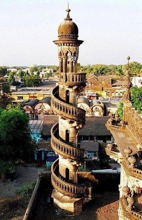 an old building with a clock tower in the middle