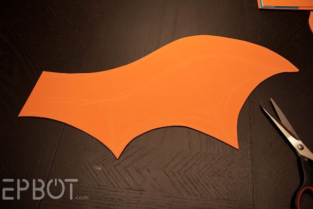 an orange bat cut out next to scissors