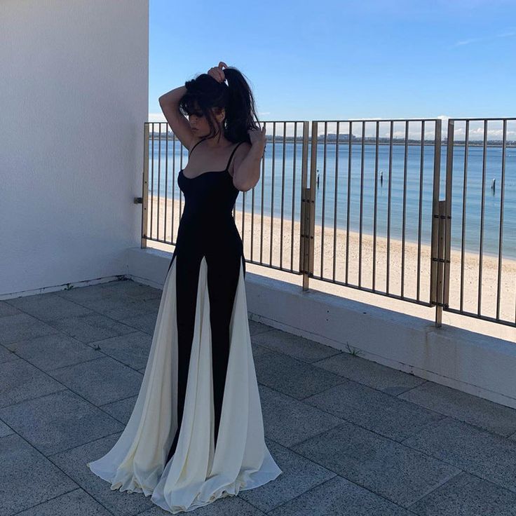 Features: This elegant maxi dress features a frill hem and spaghetti straps, perfect for parties and clubs. The contrast color adds a touch of sophistication, while the backless design adds a sultry edge. Stand out and feel confident in this new addition to your wardrobe. Black Backless Spaghetti Strap Dress For Prom, Black Spaghetti Straps Backless Dress For Prom, Black Spaghetti Strap Backless Prom Dress, Black Spaghetti Strap Slip Dress For Gala, Black Maxi Slip Dress For Prom, Black Suspender Dress For Prom, Black And White Long Dress, Evening Long Dress, White And Black Dress