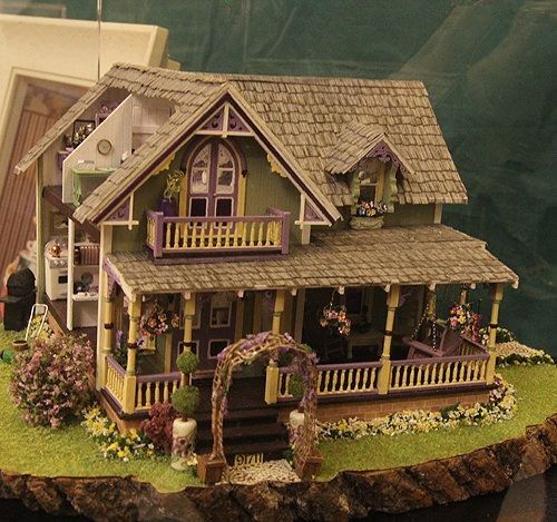 a doll house is displayed on a table