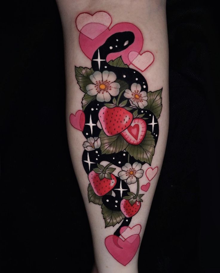 a woman's leg with tattoos and hearts painted on it, including the letter s