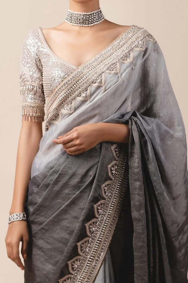 Grey ombre georgette tissue saree with dome motif hand embroidered border. Paired with sheathing blouse enhanced with 3D flower sleeves and bead tassels.
Component: 2
Embroidered
Neckline: U Neck
Sleeve Length: Half
Fabric: Georgette, Silk Tissue
Color: Grey
Cutout back
Bead tassel
Tassel tie-up back
 - Aza Fashions Traditional Organza Blouse With Dupatta, Sheer Dupatta Blouse Piece For Reception, Festive Dola Silk Blouse With Sheer Dupatta, Tissue Silk Blouse With Dupatta For Transitional Season, Transitional Tissue Silk Blouse With Dupatta, Festival Dola Silk Blouse With Sheer Dupatta, Dola Silk Blouse With Sheer Dupatta For Festivals, Sheer Dupatta Dola Silk Blouse For Festivals, Wedding Blouse With Sheer Dupatta In Dola Silk