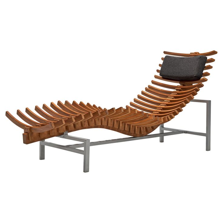 a lounge chair made out of wood and metal