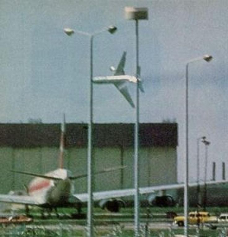 an airplane sitting on the tarmac at an airport