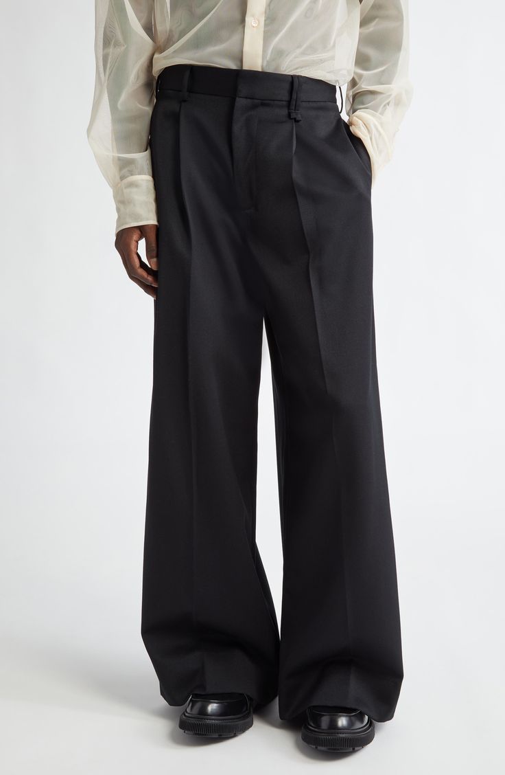 A hint of virgin wool softens clean-lined trousers that are tailored with crisp pleats. 30 1/2" inseam; 29" leg opening; 14" front rise; 16 1/2" back rise (size Medium) Zip fly with hook-and-bar closure Lined 55% polyester, 45% virgin wool Dry clean Made in Portugal Designer Clothing Asian & Pacific Islander Owned/Founded Raf Simons Menswear, Archive Fashion, Fall Fits, Wool Pants, Tailored Trousers, Black Fits, Wide Leg Trousers, Custom Clothes, I Dress