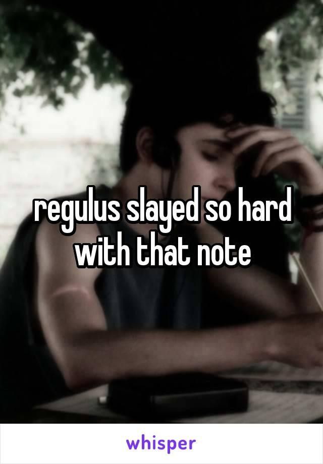 a man sitting at a table with his head in his hands and the words regulus slayer