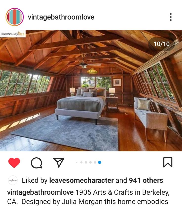 an instagramted photo of a bedroom with wood paneling and vaulted ceilings in the loft