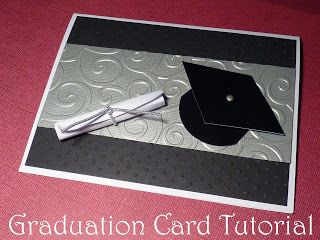 a graduation card with a cap and tassel on the top, sitting on a table