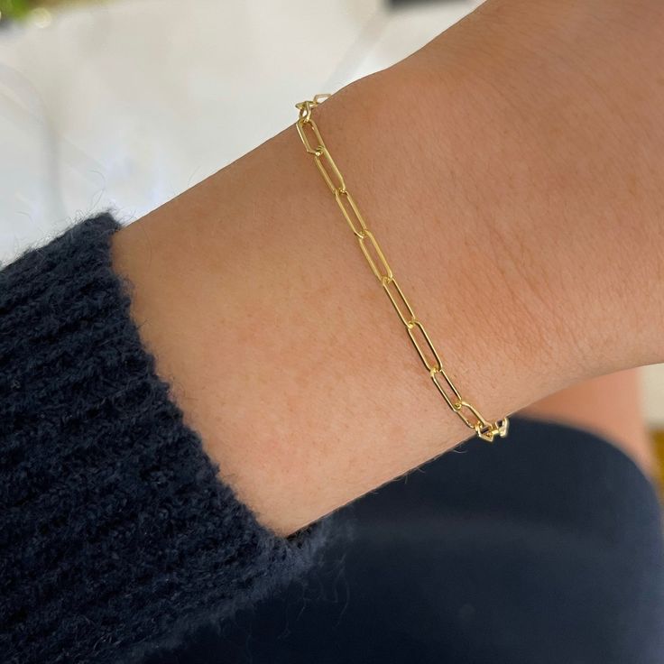 The Dani Paperclip Chain Bracelet is a best seller for a reason! This fun and contemporary design is perfect to add to your bracelet stack. Lightweight and easy to wear, you'll love to wear this bracelet year round. Metal: 14k Yellow Gold Chain Width: Approx. 2.5mm Length: 7 inches Closure: Lobster Clasp Looking for a different size? Please email us. Modern Paperclip Link Bracelet For Gift, Modern Link Paperclip Bracelet As Gift, 14k Gold Chain Bracelet With Rectangular Links As Gift, 14k Gold Chain Bracelet With Rectangular Links, Timeless Paperclip Bracelet With Adjustable Chain As Gift, Box Chain Bracelets With Rectangular Links, Fine Jewelry Adjustable Chain Bracelets For Everyday, Modern Link Bracelets As Gift, Adjustable Chain Fine Jewelry Bracelets For Everyday