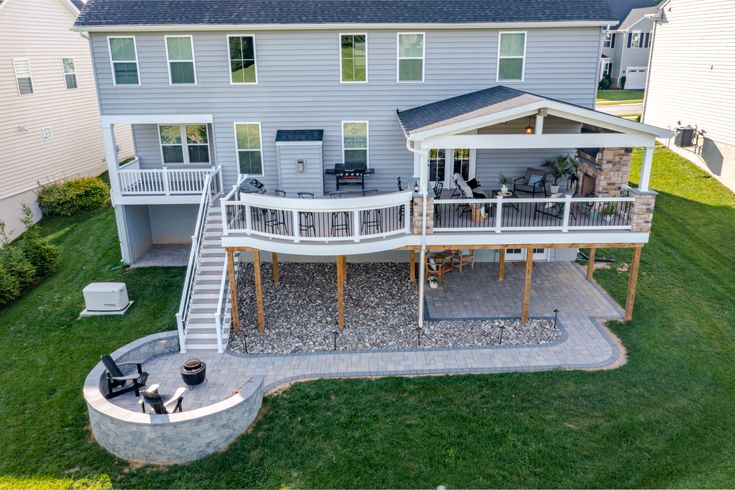 an aerial view of a house with deck and patio