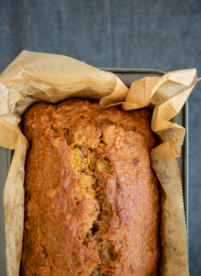 a loaf of banana bread sitting on top of a pan