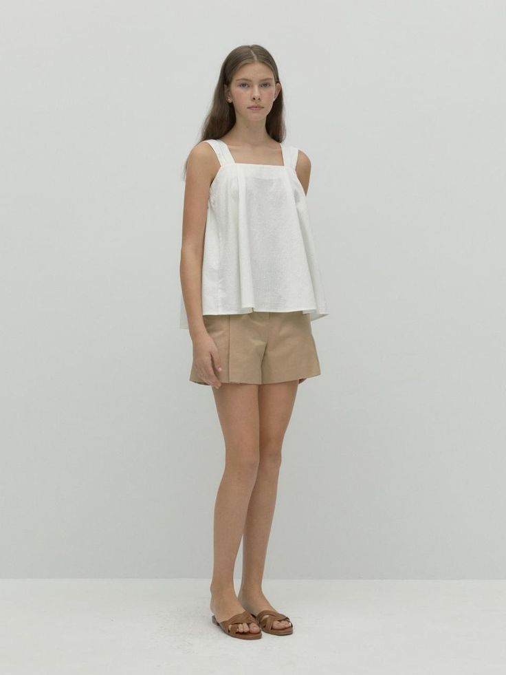 This is a trendy and feminine top by DEPOUND that is made out of high quality and sturdy material. With distinctive mood of the design and casual look, you can style it for your comfortable daily outfit.- Tuck detail on front and back- Flared silhouette- Feminine and casual mood Beige Fitted Sleeveless Top, Beige Cotton Tank Top For Work, Casual Cotton Tank Blouse, Modern Sleeveless Blouse For Summer, Modern Sleeveless Summer Blouse, Chic Tank Blouse, Modern Sleeveless White Tops, Chic Daywear Tops, Chic Sleeveless Blouse For Daywear