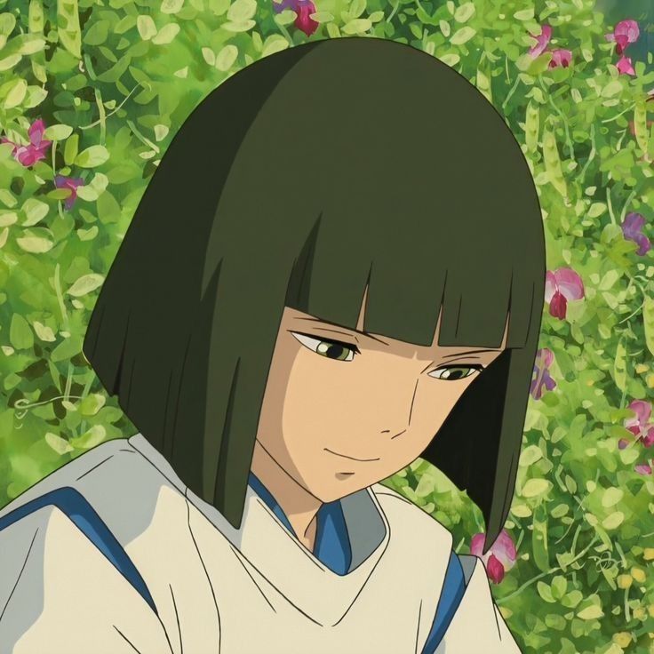 an anime character with long black hair and blue eyes in front of green plants, looking at the camera