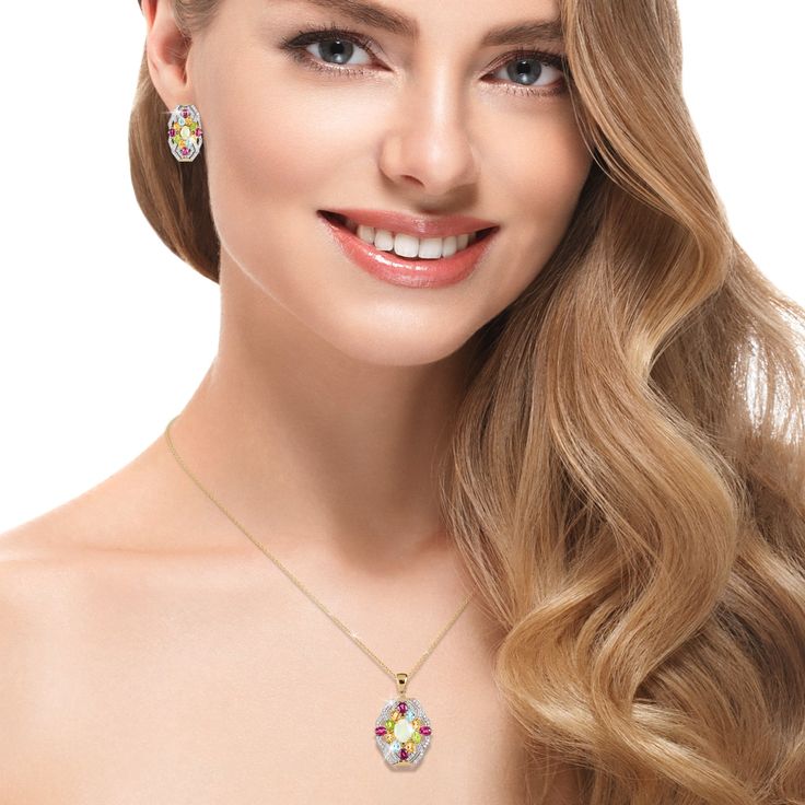 A celebration of artistry and color. Finely crafted from sterling silver, finished in 18k yellow gold, this ornate ensemble is a testament to your timeless style. An intricate arrangement of colorful gemstones, each chosen for its unique charm creates a charming focal point. An opulent Opal sits at the heart, surrounded by radiant Rhodolites, warm Citrines, refreshing Peridots and serene Blue Topaz. The dynamic interplay of hues creates a mesmerizing kaleidoscope that captures attention and sparks conversation. Embrace the enchantment of this collection and let your style speak volumes with every step. Exquisite Multicolor Oval Jewelry, Exquisite Multicolor Multi-stone Jewelry, Elegant Multi-stone Gold Plated Jewelry, Elegant Multi-stone Gold-plated Jewelry, Elegant Gold Multi-stone Jewelry Sets, Elegant Multi-stone Gold Jewelry Sets, Elegant Gold Plated Multi-stone Jewelry, Multicolor Gold-plated Jewelry With Matching Earrings, Multicolor Gold Plated Jewelry With Matching Earrings