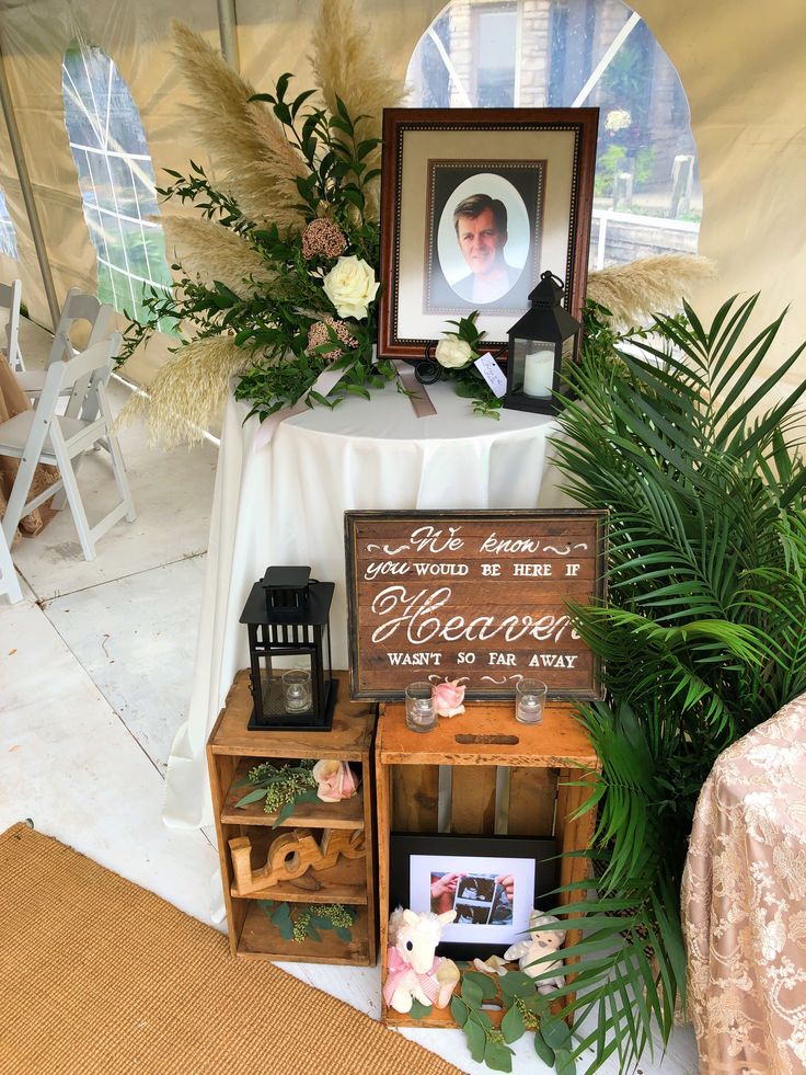 a table with flowers and pictures on it