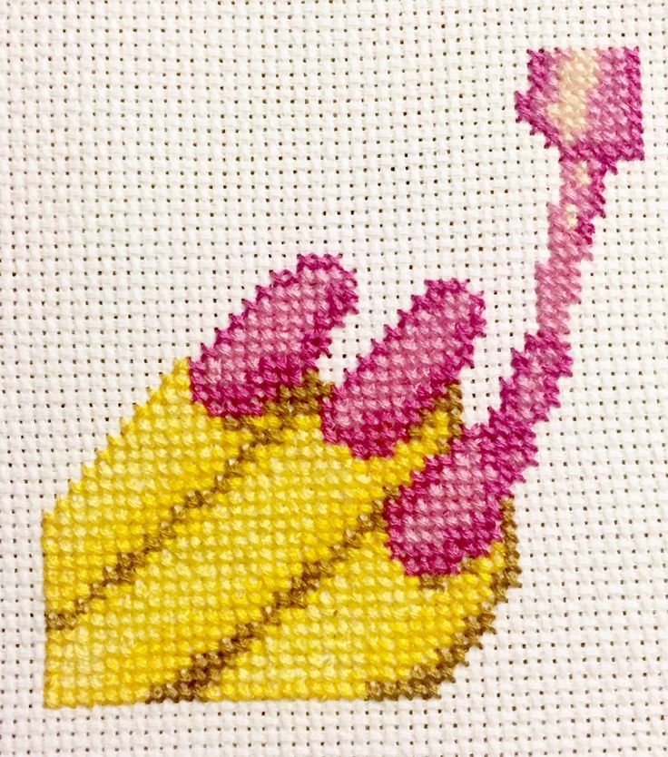 a cross - stitch picture of a pink and yellow flower on a white background with the word love written across it