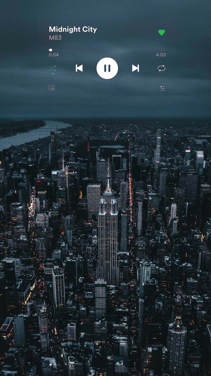 an aerial view of a city at night with the lights on and headphones out