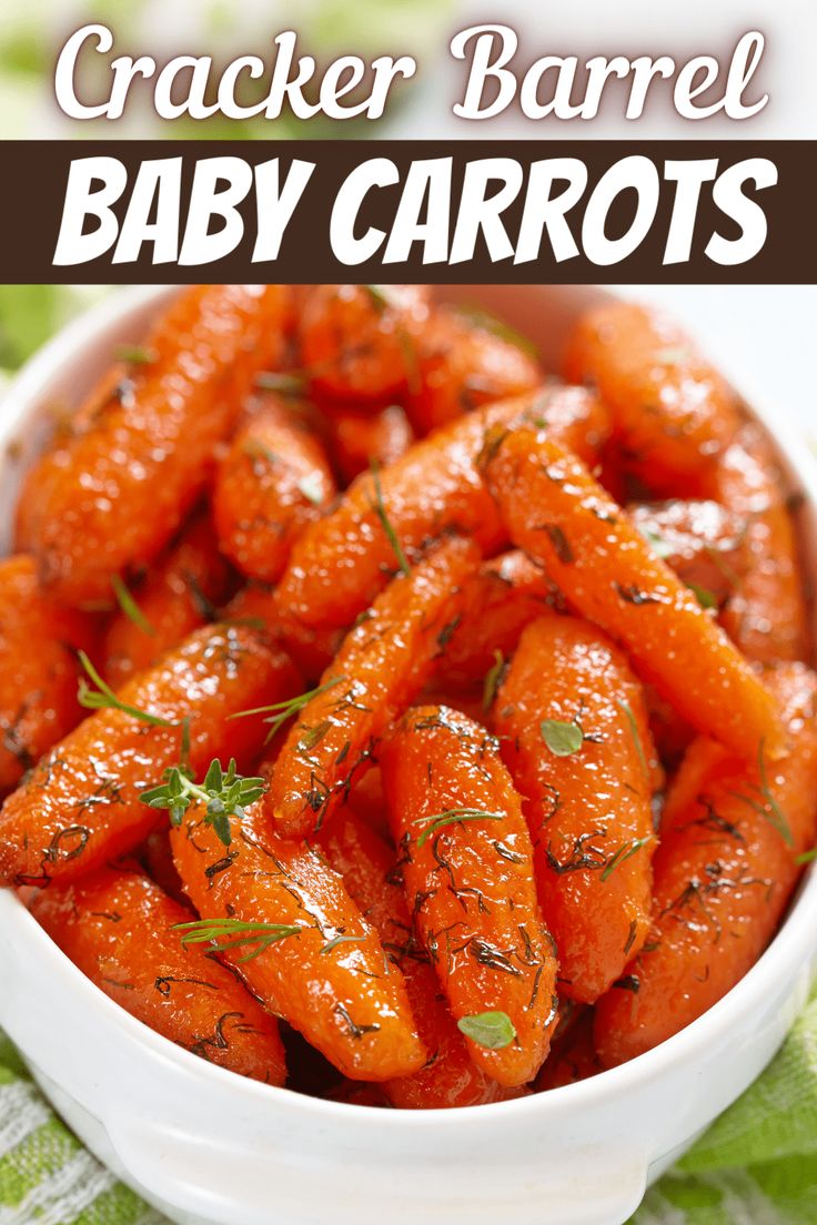 a white bowl filled with baby carrots on top of a green table cloth and text overlay that reads cracker barrel baby carrots